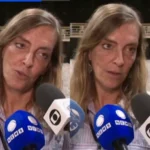 Imagem com duas cenas lado a lado da dra Tatiana Sampaio sendo entrevistada por veículos de imprensa. Ela fala ao microfone em um auditório, com cadeiras ao fundo, enquanto diferentes emissoras registram a entrevista.